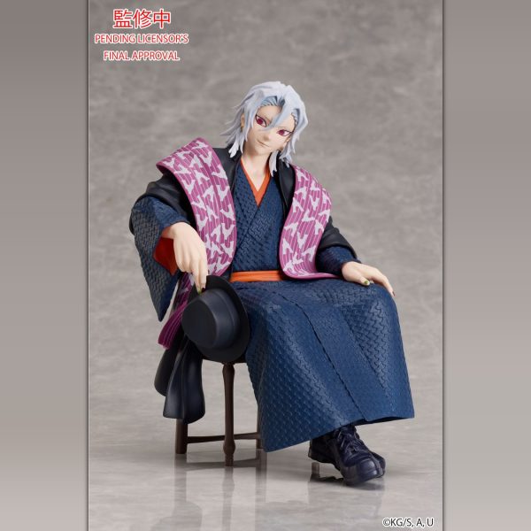 Muzan Kibutsuji figurine sitting in a blue kimono and purple shawl, holding a black hat. Pending licensor's final approval