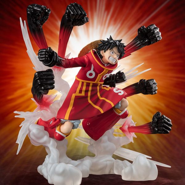 Monkey D. Luffy figure in red Egghead outfit, performing a Gatling attack with multiple black-clad fists