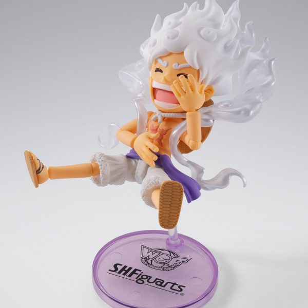 Monkey D. Luffy Gear 5 collectible figure in a laughing pose with white hair and clothes on a purple S.H.Figuarts stand