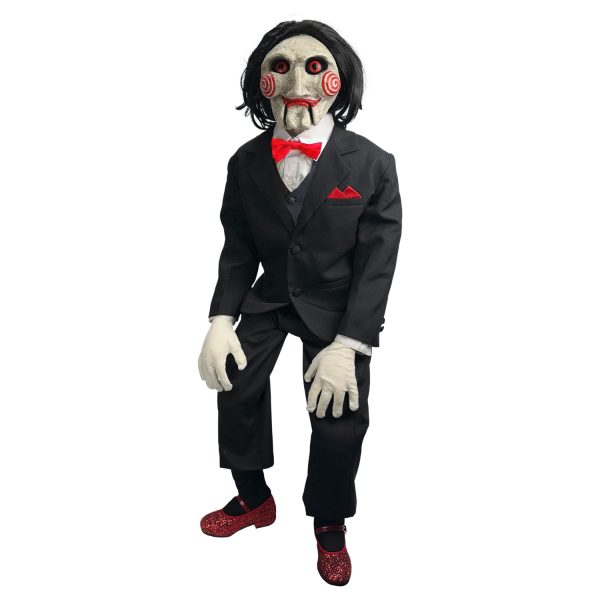 Billy the Puppet from the Saw movie franchise wearing a black suit and red bow tie