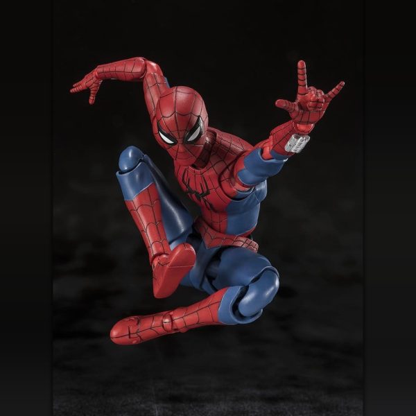Spider-Man action figure posed mid-air in a crouch, gesturing to shoot a web