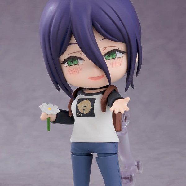 Reze Nendoroid figure with purple hair and green eyes, blushing while holding a white flower and reaching out