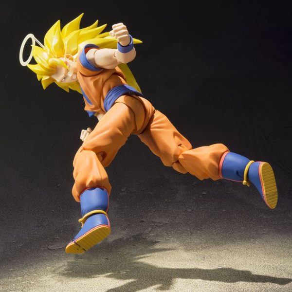 Super Saiyan 3 Goku action figure with long spiky yellow hair and a halo, posed in a dynamic mid-air strike