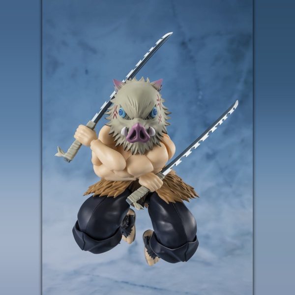 Action figure of Inosuke Hashibira wearing a boar mask and wielding two serrated swords in a dynamic pose