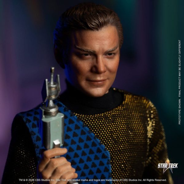 Close-up of a Captain James T. Kirk action figure prototype in a gold and blue patterned tunic