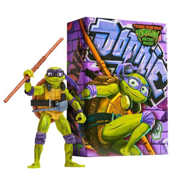 TMNT Mutant Mayhem Comic Con Donatello action figure with his bo staff, beside the graffiti-print display box